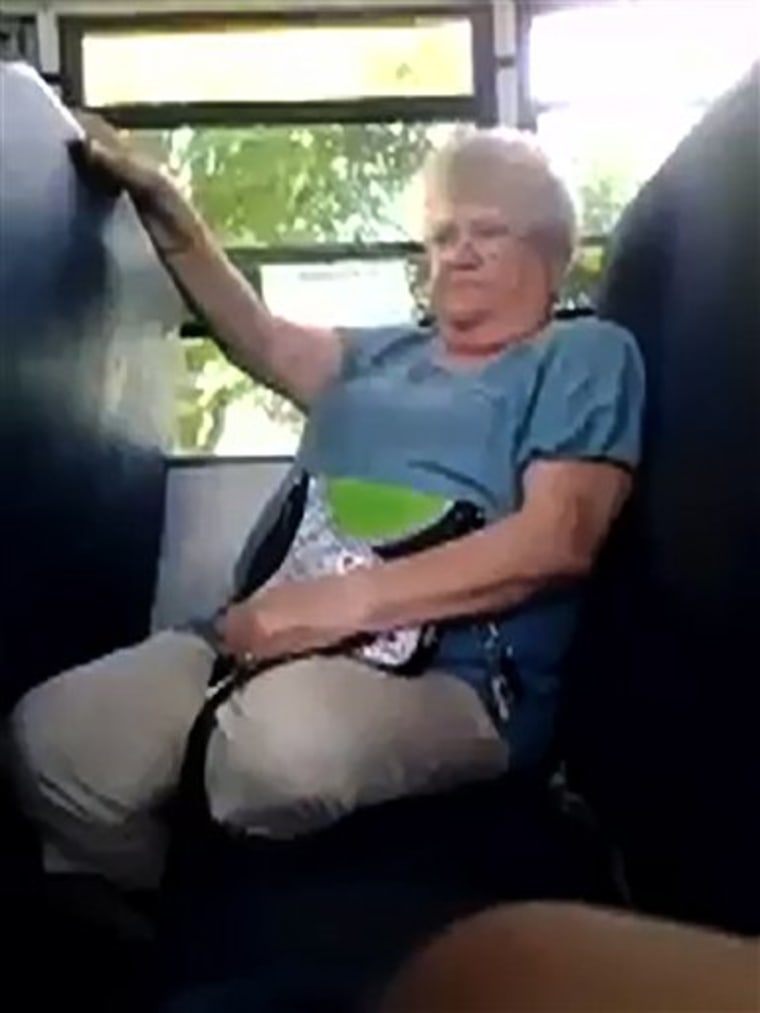 In this cellphone video image taken from YouTube via AP video, bus monitor Karen Klein reacts to several seventh-grade students mercilessly taunting her on a bus.